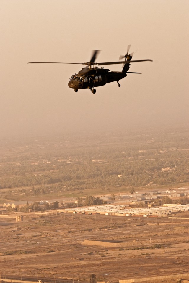 Black Hawk, Chinook teams fly over Baghdad