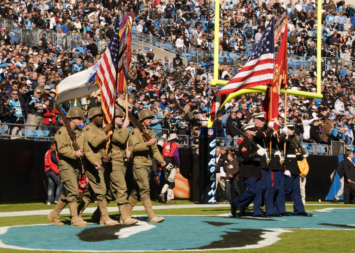 Reserve color guard NCOs honor World War II veterans during NFL game