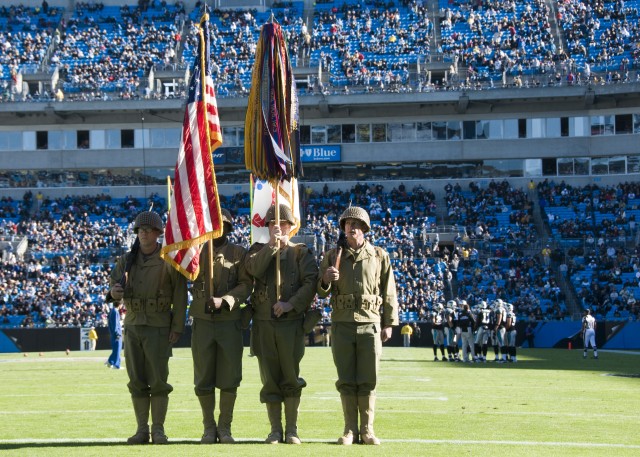Reserve color guard NCOs honor World War II veterans during NFL game