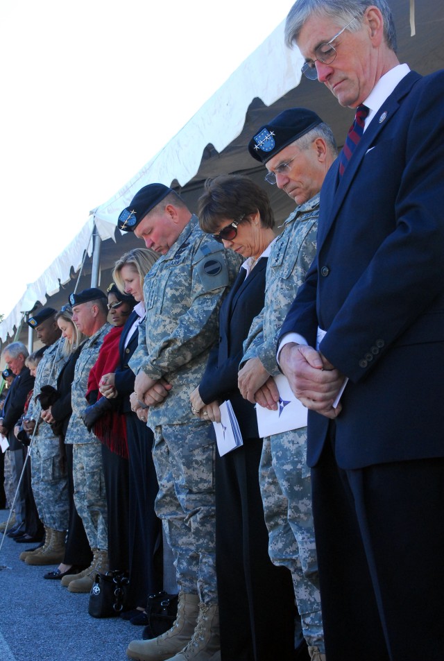Heads bow in memory at Hood