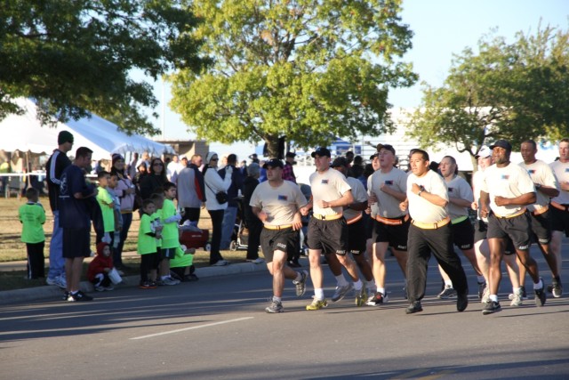 FORT HOOD, Texas - Soldiers from Company A, 2nd Battalion, 8th Cavalry Regiment, 1st Brigade Combat Team, 1st Cavalry Division, ran the five kilometer run together at the "Run to Remember" honoring those from the Nov. 5, 2009 shootings at Fort Hood, ...