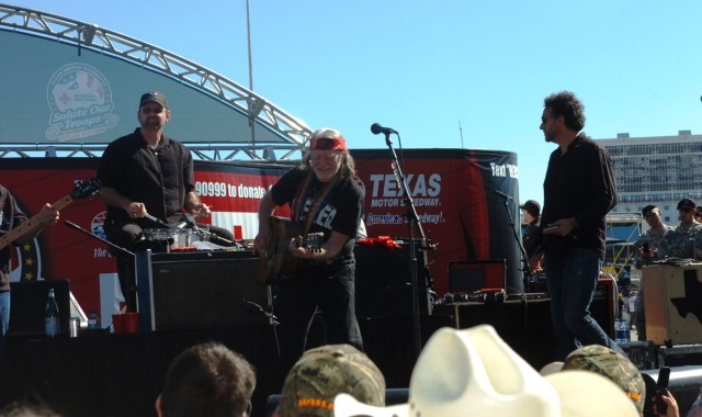 FORT WORTH, Texas - Country music artist Willie Nelson performs for Soldiers from across Texas as part of the American Red Cross "Salute to the Soldiers" event at the Texas Motor Speedway, here, Nov. 7.  Nelson was just one of several celebrities tha...