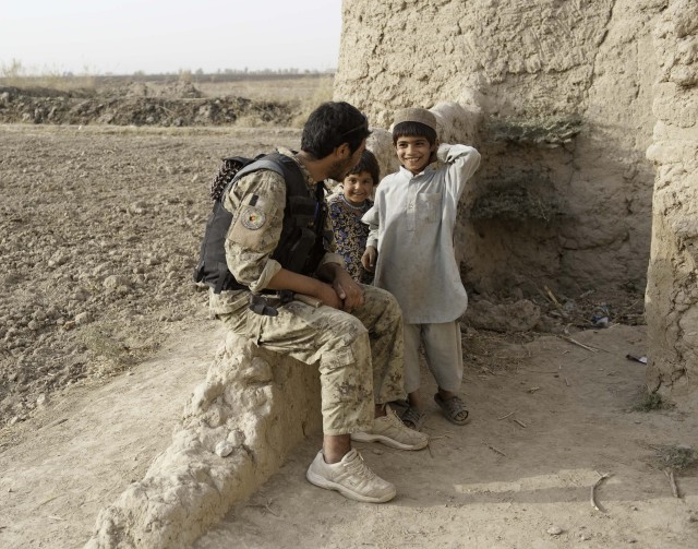 Lifeling policeman passing down commitment to Afghans security forces