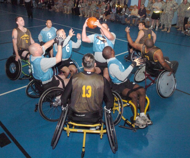 &#039;Hooping&#039; For a Cause: Wheelchair Basketball Challenges Fort Hood Warriors in Transition