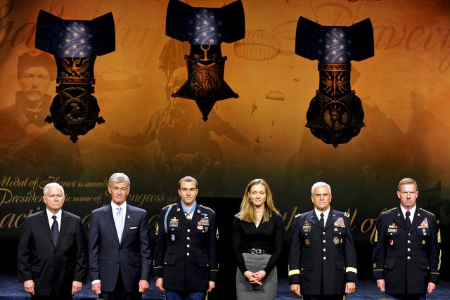 From left to right: Defense Secretary Robert M. Gates, Army Secretary John McHugh, Medal of Honor recipient Army Staff Sgt. Salvatore Giunta, his wife Jennifer Giunta, Army Chief of Staff Gen. George W. Casey Jr. and Sgt. Maj. of the Army Kenneth O. ...