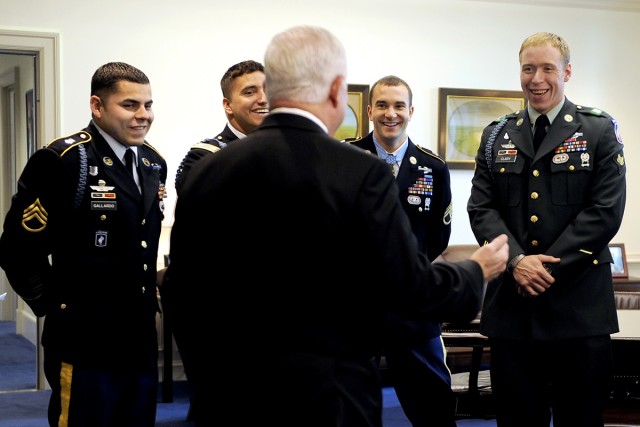 Defense Secretary Robert M. Gates shares a laugh with Medal of Honor recipient Army Staff Sgt. Salvatore Giunta, second from right, and members of Company B, 2nd Battalion, Airborne, 503rd Infantry Regiment, in Gates' office at the Pentagon, Nov. 17,...