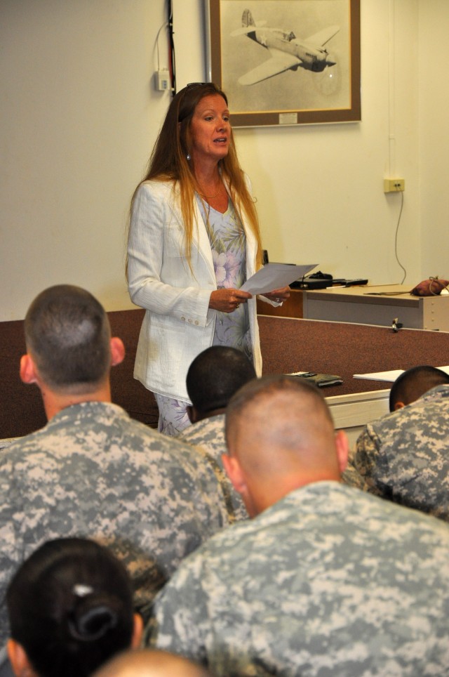 Beverly Tate, the CAB commander&#039;s wife, addresses the Soldiers about utilizing services provided by the Family Readiness Group, Oct 29