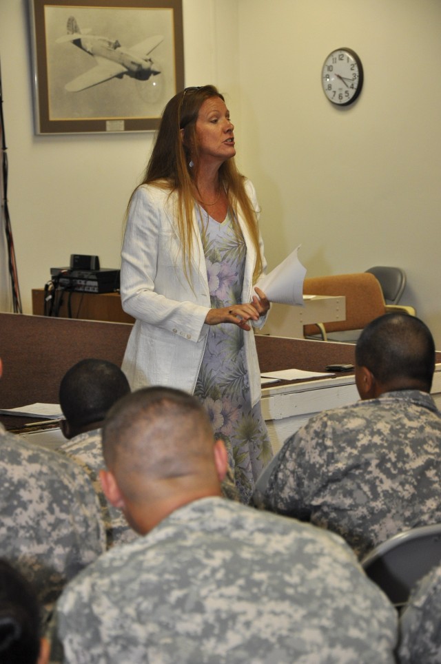 Beverly Tate, the CAB commander&#039;s wife, addresses the Soldiers about utilizing services provided by the Family Readiness Group, Oct 29. 