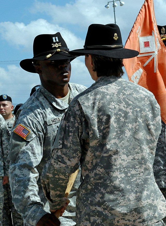 Lt. Col. Paula Lodi, the 15th Special Troops Battalion, 15th Sustainment Brigade, 13th Sustainment Command (Expeditionary), commander and a Franklin, Mass., native passes the company's guidon to Capt. Craig Battle, a Newark, N.J., native and the...