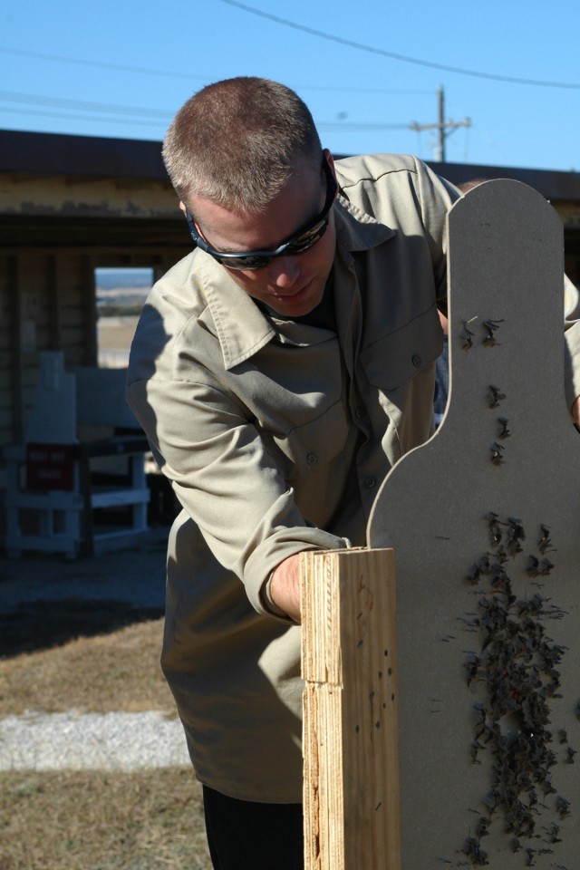 FORT HOOD, Texas-1st Lt. Jordan Swears, a native of Midland, Mich. the executive officer of A Battery, 1st Battalion, 21st Field Artillery Regiment, 41st Fires Brigade, scores his target during the hands on portion of privately owned weapons safety t...