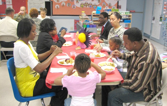 Families share early Thanksgiving meal