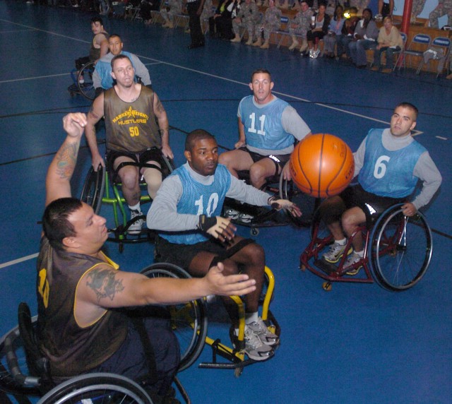 &#039;Hooping&#039; For a Cause: Wheelchair Basketball Challenges Fort Hood Warriors in Transition