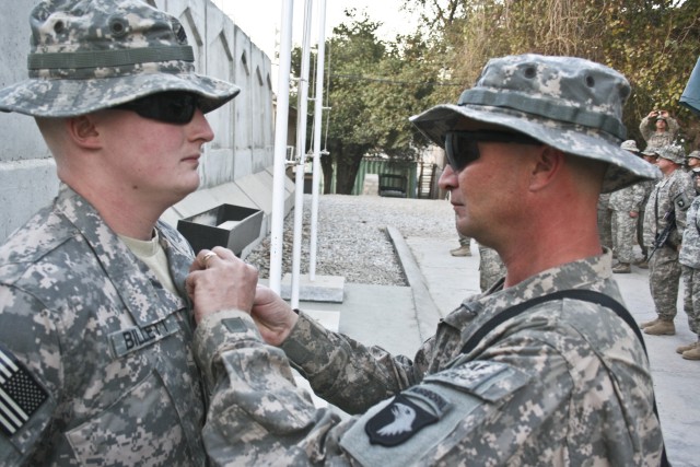 Father presents son Purple Heart Thanksgiving Day