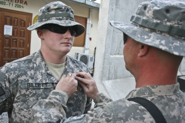 Father presents son Purple Heart Thanksgiving Day