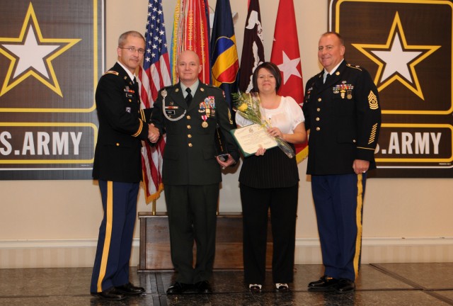 Colonel Ronald Place, the Fort Knox Medical Department Activity commander, Sgt 1st Class Charles Hibbs, a paralegal noncommissioned officer with the 3d Sustainment Command (Expeditionary), his wife Teresa, and Command Sgt. Maj. Leon Archer, the...