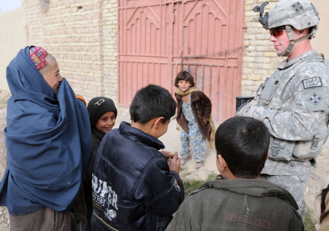 Charlie Company conducts dismounted patrol in Popal colony, in Kandahar City Afghanistan