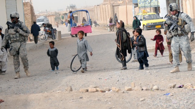 Charlie Company conducts dismounted patrol in Popal colony, in Kandahar City Afghanistan