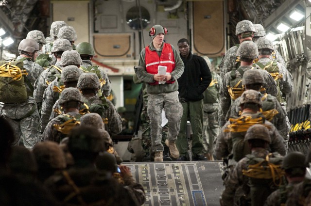 Paratroopers wait to board a C-17 during Operation Toy Drop