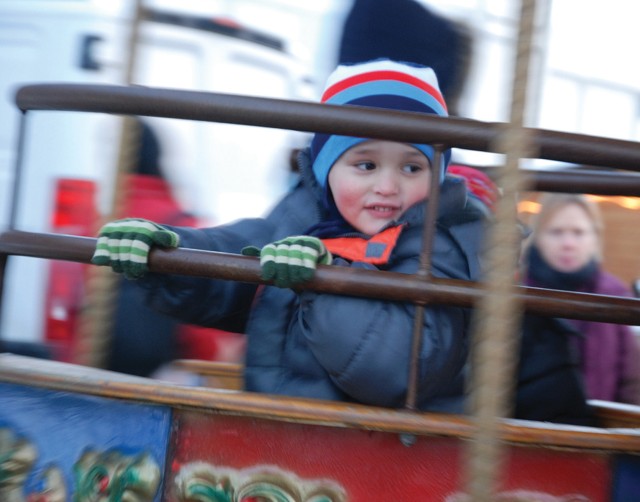 Holiday fun, community-style: USAG Stuttgart&#039;s Winterfest rings in season with music, food, rides and Santa