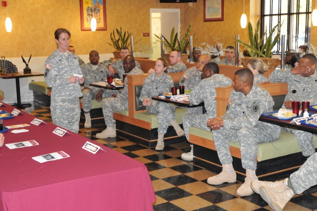 Brigadier Gen. Robin Akin, commanding general of the 3rd Sustainment Command (Expeditionary), addresses members of the 7th Sustainment Brigade during the Fiscal Year 2010 Retention Awards Luncheon at the Resolute Café, Dec. 9. (U.S. Army photo by...
