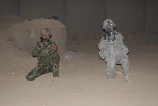 JOINT SECURITY STATION INDIA, Iraq- A Soldier assigned to A Co., 2nd Battalion, 7th Cavalry Regiment, 4th Advise and Assist Brigade, 1st Cavalry Division, provides security alongside his Kurdish security forces counterpart during combined...