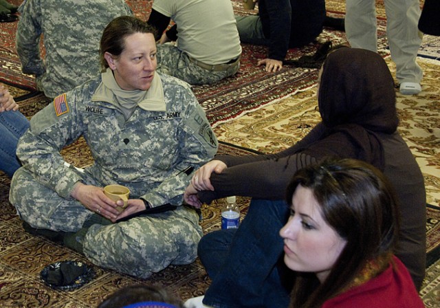 Specialist chats with Afghan woman