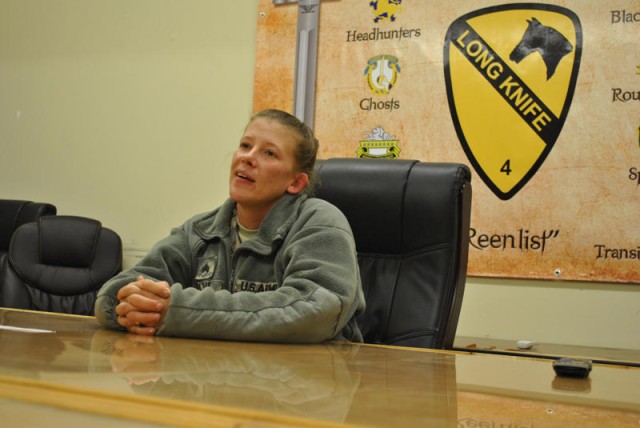 Sgt. Tammy Ellis, a combat medic assigned to C Company, 27th Brigade Support Battalion, 4th Advise and Assist Brigade, 1st Cavalry Division, looks on as she talks to her daughter, Sadie, a student at Meadow Elementary School, through a video...