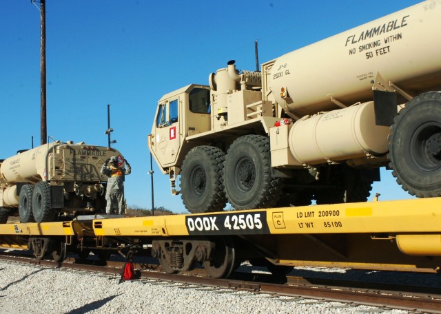 FORT HOOD, Texas- Sgt. Derrell Springer, a Brooklyn, N.Y. native and surveyor for Headquarters and Headquarters Battery, 3rd Battalion, 82nd Field Artillery Regiment, 2nd Brigade Combat Team, 1st Cavalry Division, ground-guides a fuel truck onto a...