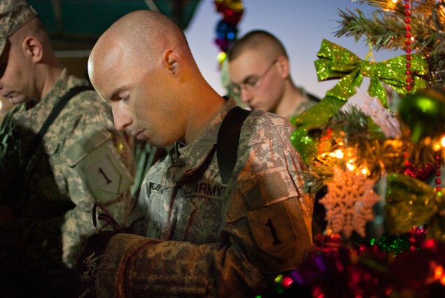 Bowing heads at holiday program