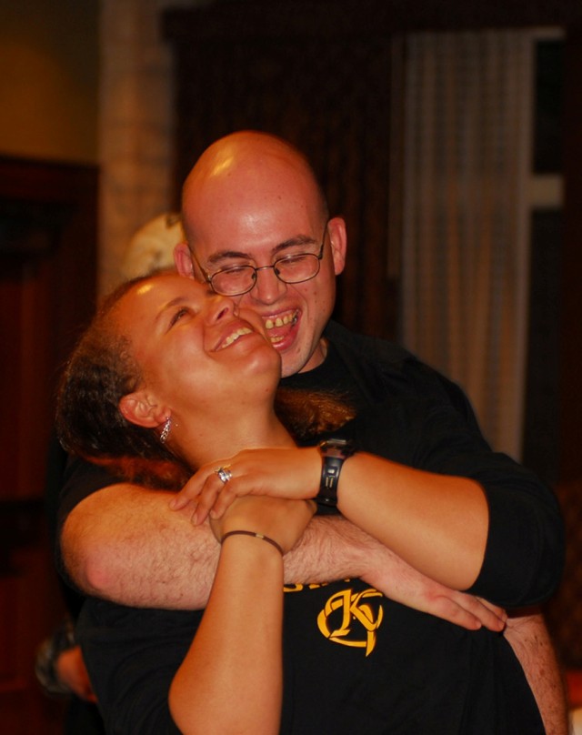 FORT HOOD, Texas-- A married couple from the 1st Air Cavalry Brigade, 1st Cavalry Division, embrace during a group exercise at a marriage retreat in Austin, Dec. 17. One of the themes of the training conducted during the retreat was how to manage...