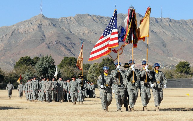 Members of the 15th Sustainment Brigade "Wagonmasters" Color Guard march across the field for "Pass in Review" during an Uncasing Ceremony on Noel Field here Dec 8. The Pass in Review is a long-standing military tradition that began as a way for a ne...