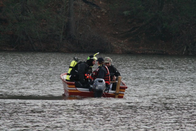Divers locate submerged firefighting equipment