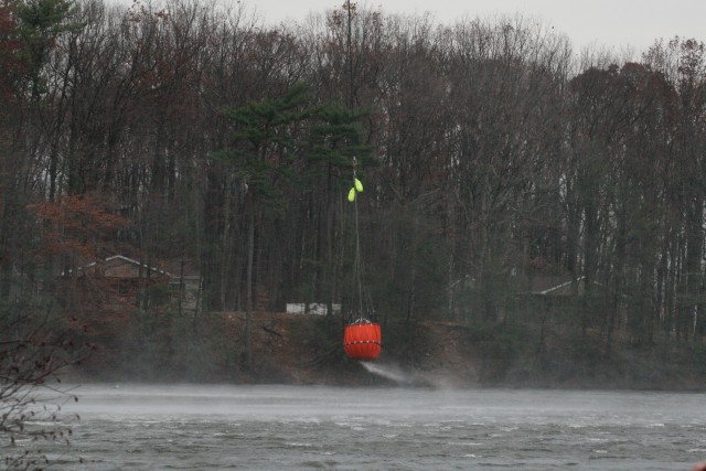 Divers locate submerged firefighting equipment