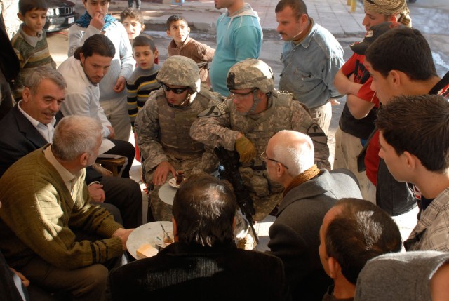 Greeting Qara Qosh locals