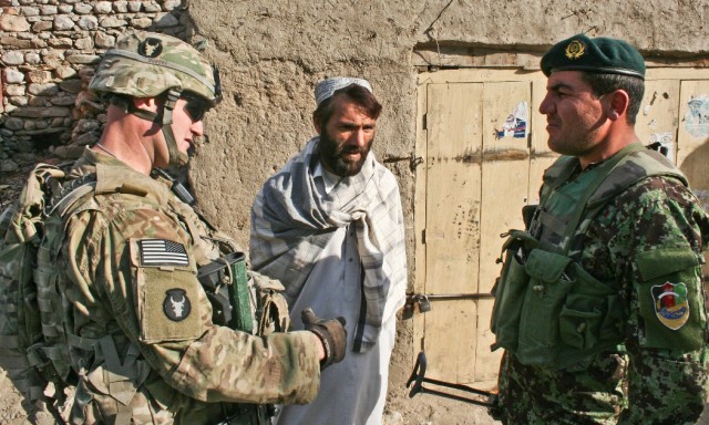 Leaders talking with Afghan citizen