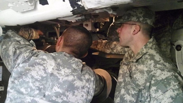 CONTINGECY OPERATING SITE MAREZ, Iraq - Staff Sgt. Steven Newman, a field artilleryman assigned to Battery B, 5th Battalion, 82nd Field Artillery Regiment, 4th Advise and Assist Brigade, 1st Cavalry Division, practices testing procedures for fire...
