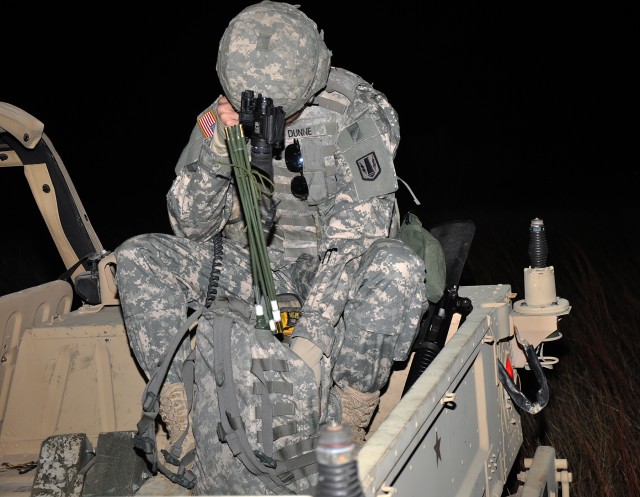 FORT HOOD, Texas- FORT HOOD, Texas-Pfc. Joshua Dunne, from Fresno, Calif. Battery A, 26th Field Artillery Regiment (Target Acquisition Battery), 41st Fires Brigade, conducts a radio check during a joint operation training mission with the 171st...