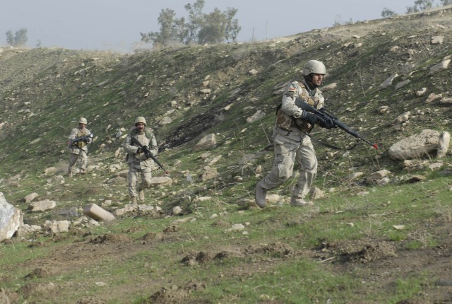 CONTINGENCY OPERATING SITE MAREZ, Iraq - Soldiers assigned to 1st Battalion, 11th Brigade, 3rd Iraqi Army Division, practice basic infantry drills  during squad-level training at al-Ghuzlani Warrior Training Center, Jan. 6. Soldiers assigned to 1st S...