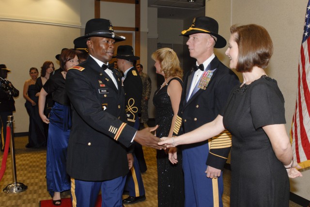 FORT HOOD, Texas - Command Sgt. Maj. Ronnie Kelley and his wife Alice greet guests of the Greywolf Gala, a military ball by 3rd Brigade Combat Team, 1st Cavalry Division, Jan. 7 at the Killeen Civic Center. The ball promoted unit cohesion and camarad...