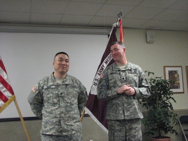 Army specialist pins on captain&#039;s bars