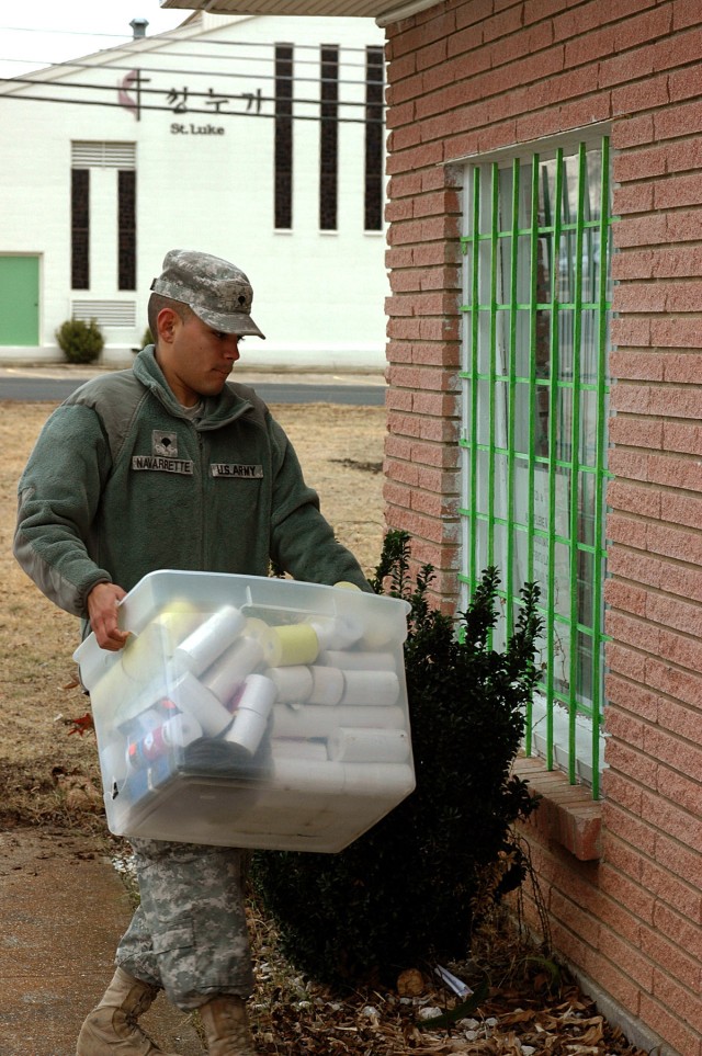 FORT HOOD, Texas -  Spc. Cesar Navarrette, a Phoenix native and an allied trade specialist for the 575th Forward Support Company, 41st Fires Brigade, carries a box of household goods to help move the God's Word Ministries, a non-profit organization, ...