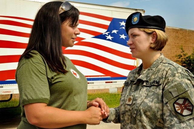 Red Cross representative speaks with Soldier