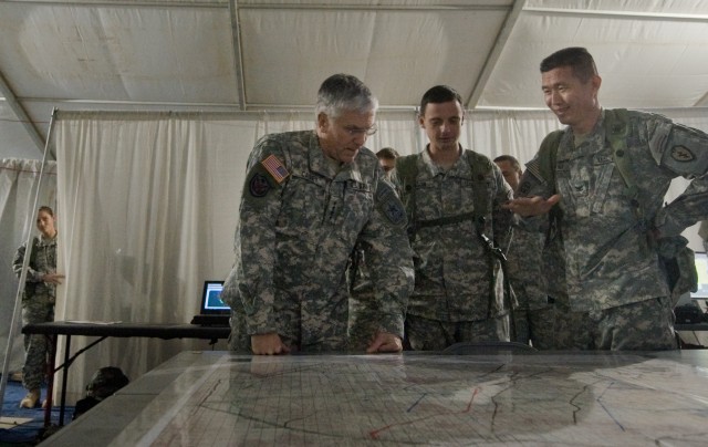 COL Richard C. Kim Brigade 3rd Brigade Combat Team Commander briefs Chief of Staff of the Army Gen. George W. Casey Jr. at the National Training Center (NTC) in Ft. Irwin, CA, on Jan. 22, 2011.  The mission of the NTC is to provide  realistic,...