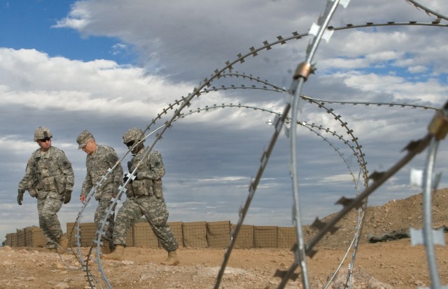 Brig. Gen. Robert "Abe" Abrams leads the Chief of Staff of the Army Gen. George W. Casey Jr. during his visit at the National Training Center (NTC) in Ft. Irwin, CA, on Jan. 22, 2011.  The mission of the NTC is to provide  realistic, joint and...