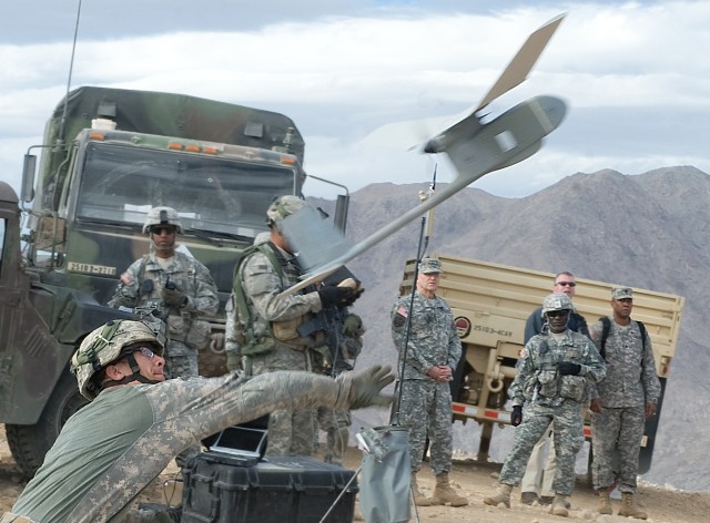 Cpl. Sean Connell during a training launches a  Raven while providing a demo to Chief of Staff of the Army Gen. George W. Casey Jr. at the National Training Center (NTC) in Ft. Irwin, CA, on Jan. 22, 2011.  The mission of the NTC is to provide...