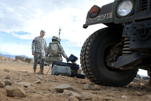 Chief of Staff of the Army Gen. George W. Casey Jr. is briefed by Cpl. Sean Connell during a training exercise at the National Training Center (NTC) in Ft. Irwin, CA, on Jan. 22, 2011.  The mission of the NTC is to provide realistic, joint and...