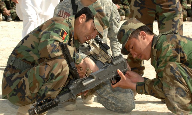 ANA recruits take apart a weapon