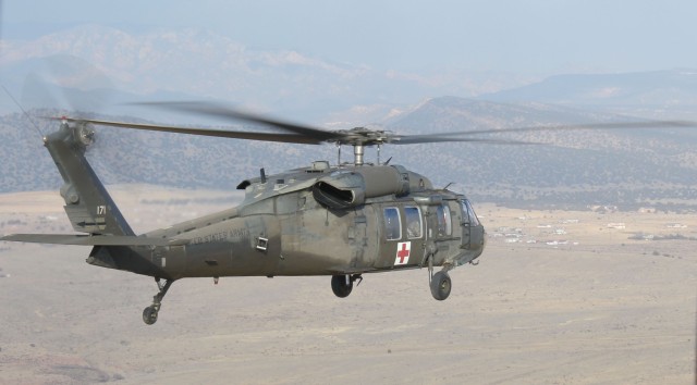 FORT CARSON, Colo.-A UH-60A Black Hawk helicopter from the 1st Air Cavalry Brigade, 1st Cavalry Division, takes to the skies during high altitude, mountain environmental training near Fort Carson, Colo., Jan. 18. The pilots and crew chiefs of the...