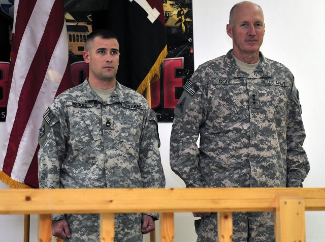 CONTINGENCY OPERATING SITE WARRIOR, Iraq - Lt. Gen. Robert Cone, right, deputy commanding general of operations, U.S. Forces-Iraq, and Sgt. 1st Class Isaac McKee, platoon sergeant, Company B, 2nd Battalion, 12th Cavalry Regiment, 4th Advise and...