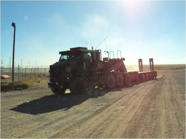 An M1070/M1000 HET (Heavy Equipment Transport) system pulls into the Dona Anna Motor Pool in preparation for transporting equipment back to Fort Bliss in support of 4th Brigade, 1st Armor Division gunnery mission. (U.S. Army photo by 1st Sgt. Allen J...